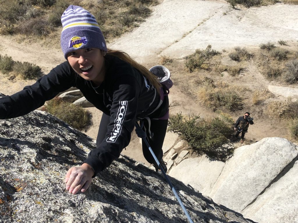 Vivi Dang rock climbing