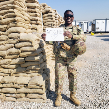 Dimitri Tito, DO in military fatigues in Northern Iraq. He is holding a 