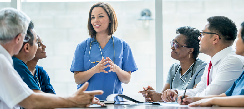 doctor presenting to health providers at a meeting