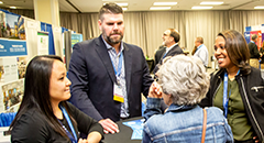 Conference attendees in the exhibit hall