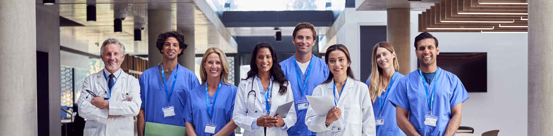 Smiling male and female doctors of multiple ethnicities