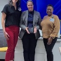 ThreewomenstandtogetherinaprofessionalsettingattheUniversityofNorthTexasHealthScienceCenter-TexasCollegeofOsteopathicMedicineUNTHSC-TCOMoneholdinganawardorplaque