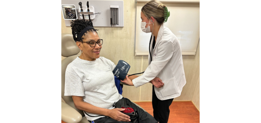 Medical student takes the blood pressure of a patient