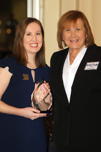 Dr. Hill receiving glass award