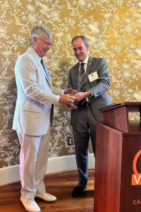 Tom Lindsey, II, DO, FACOS receives a plaque in appreciation of his service as 2022–2023 SCOMS President.