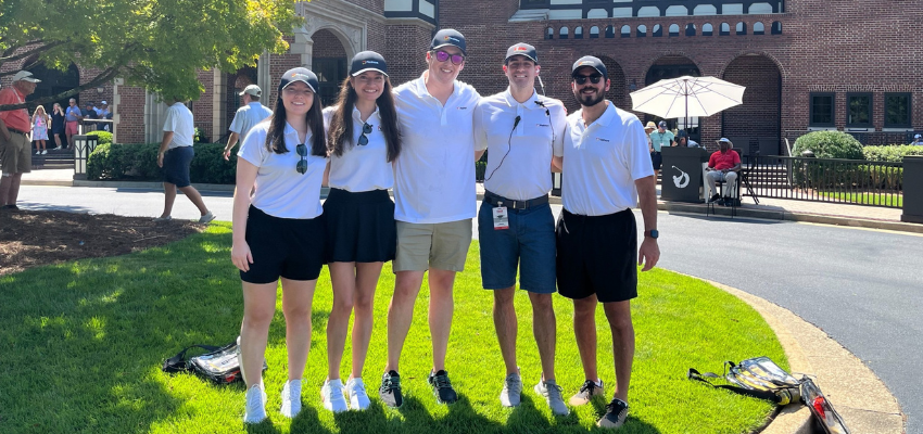 PCOM Faculty members with four students outside golf course entrance