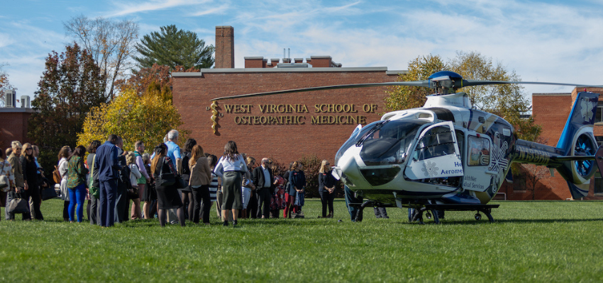 Leadership members watch helicopter on WVSOM lawn
