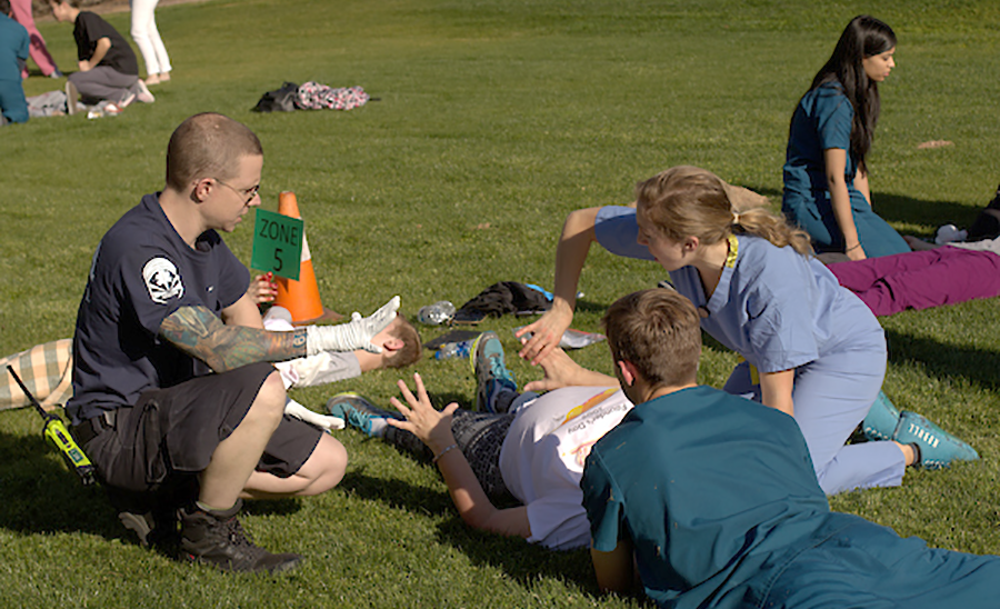 ATSU-SOMA students triaging a patient during a mass casualty simulation exercise.