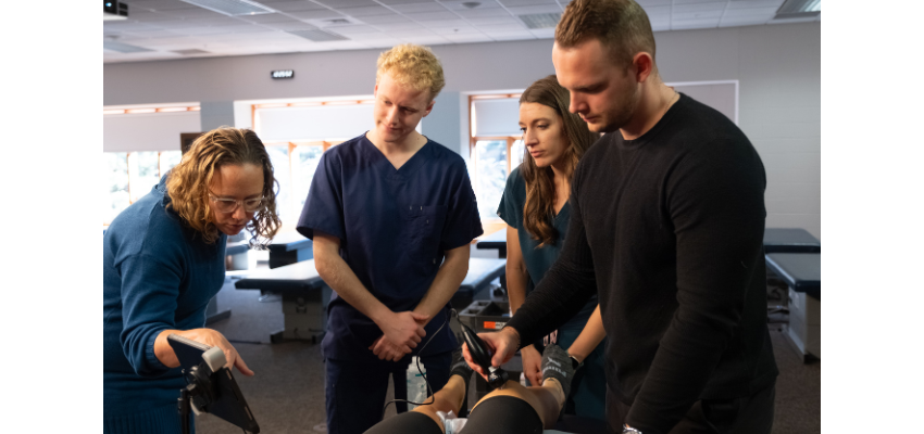 Student takes ultrasound of a knee