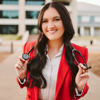 Kylie in a red blazer with a stethoscope 