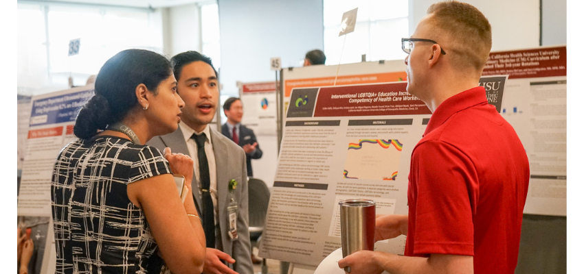 Students discuss insights from poster