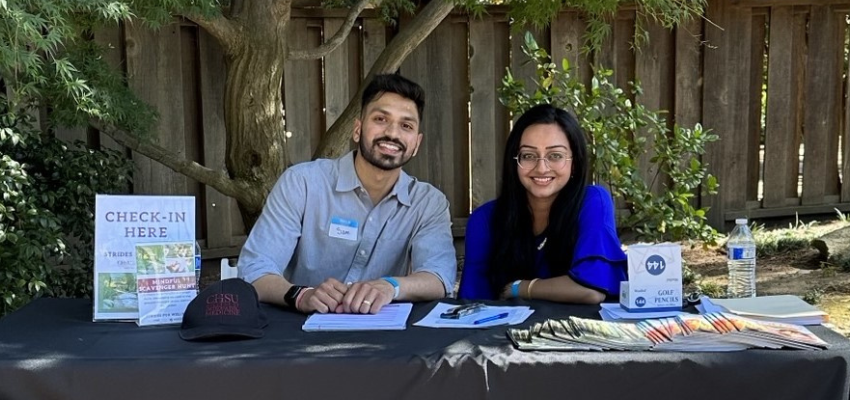 Two medical students at the CHSUCOM check-in table.