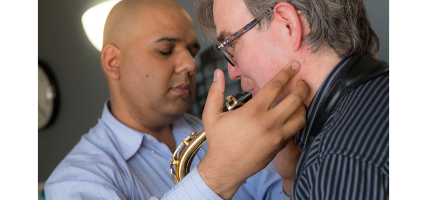 UNTHSC faculty member practicing osteopathic manipulative treatment on a patient.