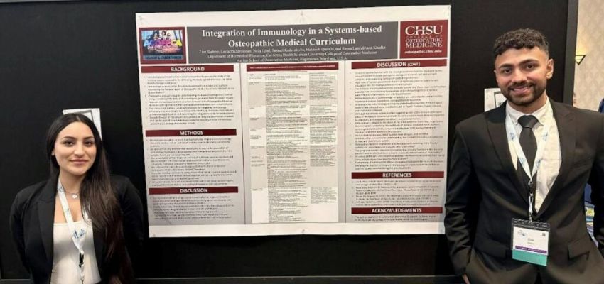 Two CHSU-COM students stand in front of their research poster on integrating immunology into the osteopathic medical curriculum.