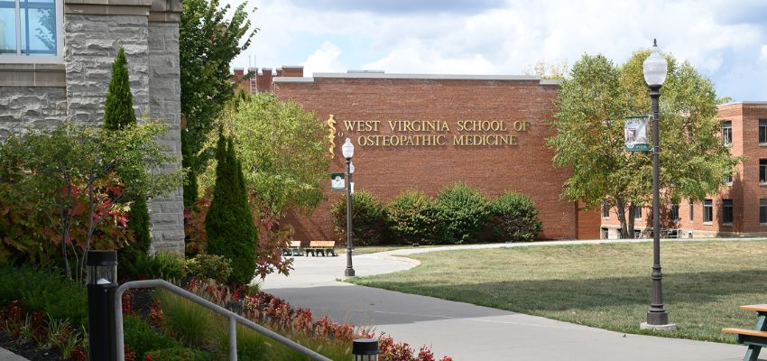 Campus view of the West Virginia School of Osteopathic Medicine with the school's building prominently displayed.